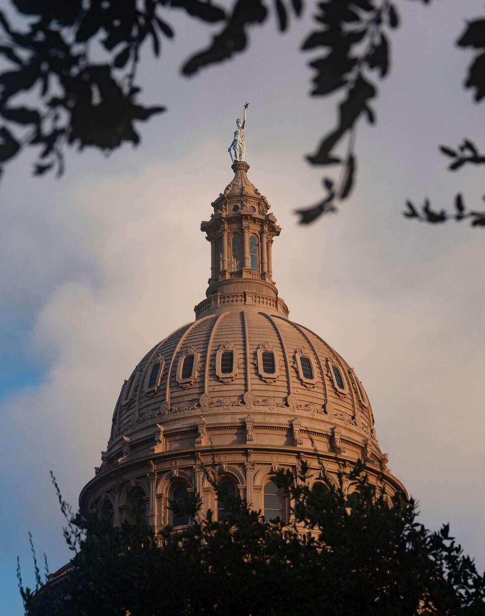 The Texas Capitol dome glows as the run rises on the second day of the impeachment trial for...