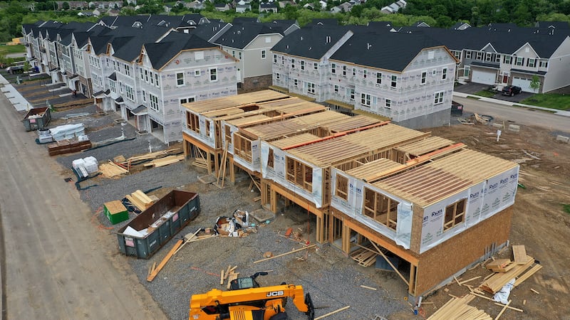 File - Townhomes under construction are shown in Mars, Pa., on May, 27, 2022. On Thursday,...