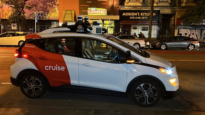 Associated Press reporter Michael Liedtke sits in the back of a Cruise driverless taxi that...