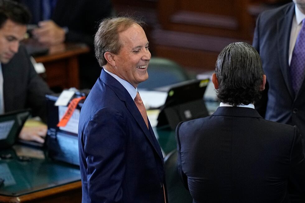 Texas state Attorney General Ken Paxton, left, talks with his attorneys before his impeachment...