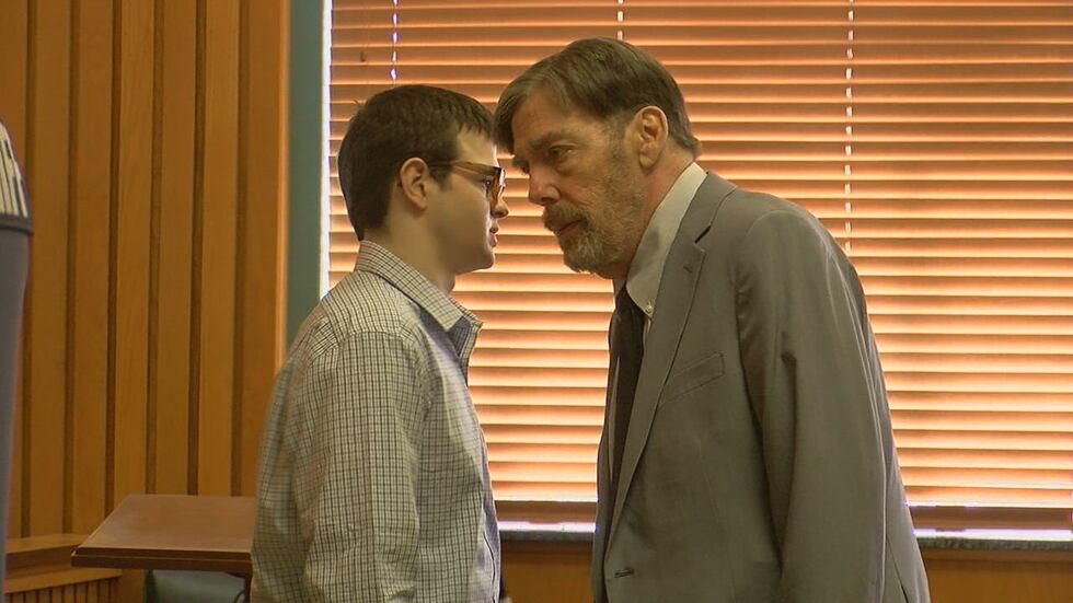 Bobby Woods, Jr. speaks with his lawyer, John Tunnell, before opening statements got underway...
