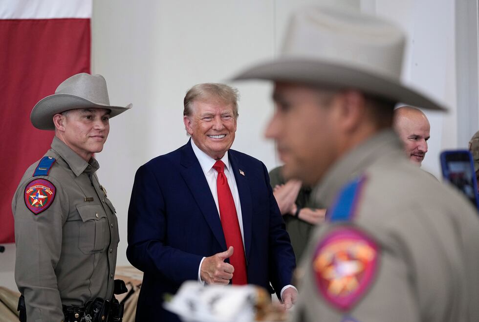 Republican presidential candidate and former President Donald Trump helps serve food to Texas...