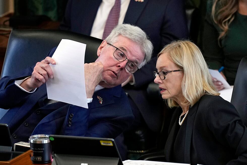 Texas Lt. Gov. Dan Patrick, left, talks with legal counsel Lana Myers, right, during the...