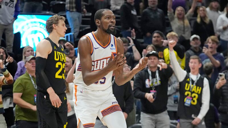 Phoenix Suns forward Kevin Durant (35) reacts after he was initially whistled for a foul on...
