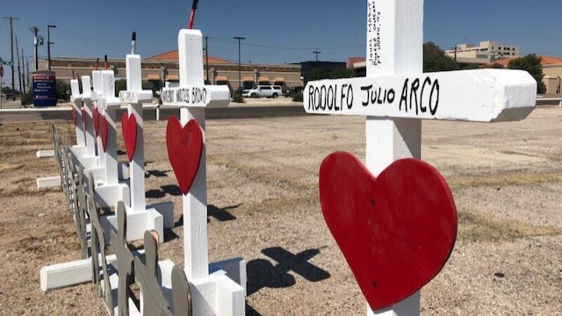 A cross with the name Rodolfo Arco is erected as a memorial to the 57-year-old who was killed...